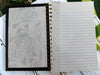 Embossed/textured black spiral-bound hard cover journal/notebook