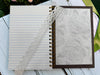 Embossed/textured black spiral-bound hard cover journal/notebook